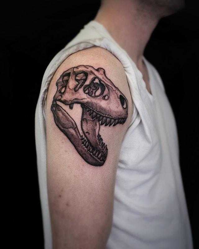 Tattoo by Adam LoRusso artist black and grey boston skull dinosaur
