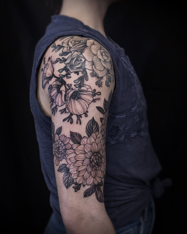 Tattoo by Adam LoRusso artist black and grey boston floral half sleeve