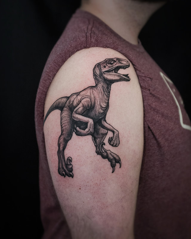 Tattoo by Adam LoRusso artist black and grey boston raptor dinosaur tattoo